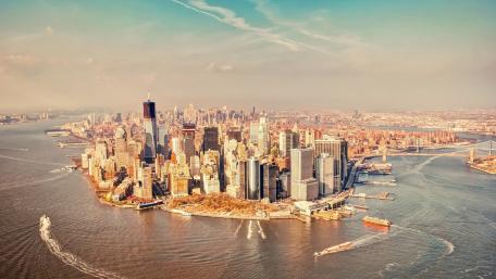 Golden Aerial View of Lower Manhattan Skyline and One World Trade Center wallpaper