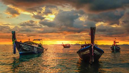 Long Tail Boats at Dusk on Phi Phi Islands Horizon wallpaper