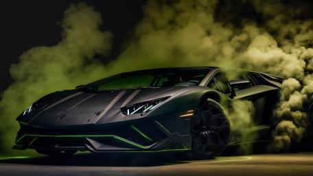 Lamborghini Aventador Emerging Through Neon Green Smoke wallpaper