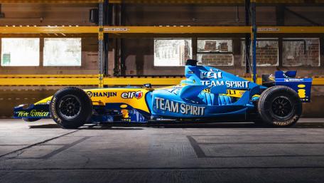 Renault R25 Formula One Car Profile in Industrial Garage 4K wallpaper