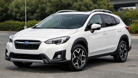 Sleek White Subaru Compact SUV Ready for Urban Adventures wallpaper