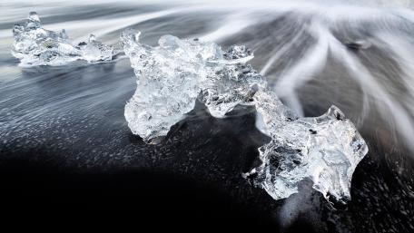 Glacial Shards on Black Sand in Monochrome Motion wallpaper