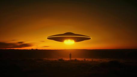 Silent Sunset Encounter Beneath the Hovering UFO wallpaper