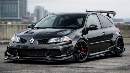 Stealth Black Renault Hot Hatch in Urban Skyline Light wallpaper