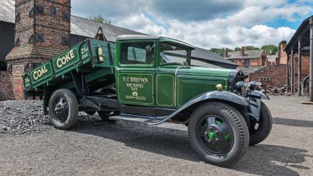 Vintage Ford Model AA Coal Truck in Industrial Yard 4K Wallpaper wallpaper