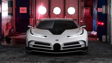 White Bugatti Centodieci Hypercar in Neon Garage Glow wallpaper
