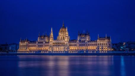 Budapest Parliament Glowing Over the Danube at Blue Hour wallpaper