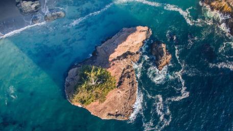 Aerial Ocean Swell Around Lone Rock Island wallpaper