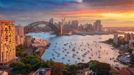 Sunset Glow Over Sydney Harbour Bridge and City Skyline wallpaper