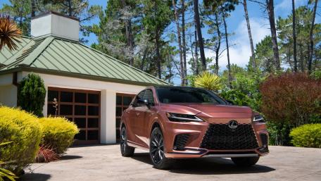 Copper Lexus RX Hybrid SUV in Modern Driveway Serenity wallpaper