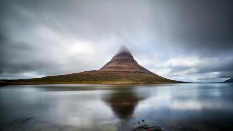Misty Kirkjufell Reflection in Moody Icelandic Stillness wallpaper
