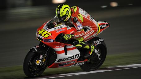 Ducati MotoGP Racer Leaning Hard Through Night Circuit wallpaper