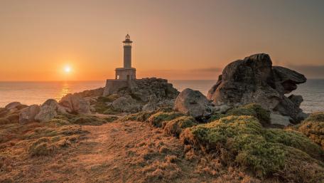 Sunset Sentinel at Punta Nariga Lighthouse on the Galician Coast wallpaper