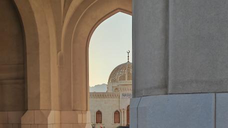 Sunlit Palace Dome Framed by Arches in Muscat Oman wallpaper