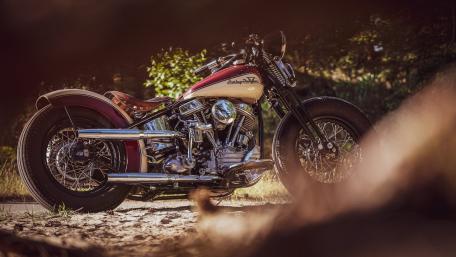 Vintage Harley Davidson Cruiser In Golden Hour Roadside Glow wallpaper