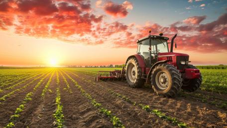 Sunrise Power Tractor Working the Freshly Planted Field in 5K wallpaper