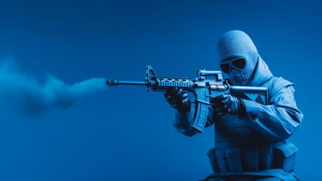 Blue Tinted Masked Soldier Aiming Rifle In Tactical Silence wallpaper