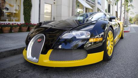 Bugatti Veyron Black and Yellow Street Supercar 4K Wallpaper wallpaper