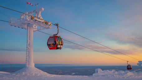 Frosted Cable Car Gliding Over Ylläs Lapland Winter Sunset wallpaper