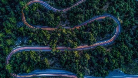 Twisting DN1A Mountain Road Through Cheia Forests Romania wallpaper