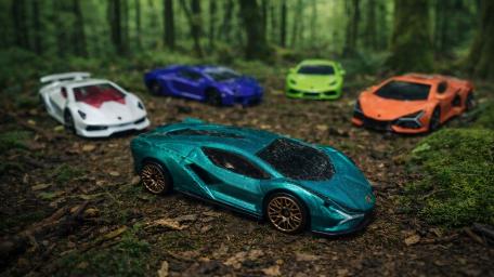 Lamborghini Hypercar League Miniatures in a Misty Forest Scene wallpaper