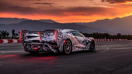 McLaren Sabre Prototype Supercar Under a Fiery Sunset Sky wallpaper