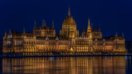 Golden Hungarian Parliament Reflections on the Danube at Night wallpaper