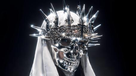 Chromed Skull Sovereign Wearing a Spiked Crown in Moonlit Shadow wallpaper