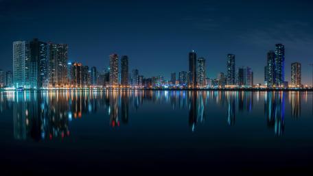 Sharjah Night Skyline Reflections Over Still Waters in the UAE wallpaper