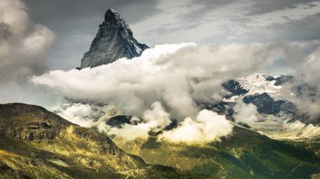 Matterhorn Peak Rising Above Alpine Clouds in Zermatt Switzerland wallpaper