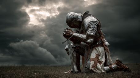 Stormbound Templar Knight Kneeling in Reverent Silence wallpaper