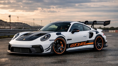 Porsche 992 GT3 RS Trackside at Sunset with Bold Orange Accents wallpaper