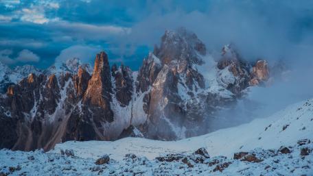 Misty Sunrise Over Tre Cime di Lavaredo Peaks in the Dolomites wallpaper
