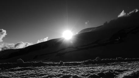 Majestic Winter Sunrise Over Snowy Slopes wallpaper