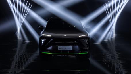 NIO ES6 Night Explorer SUV Under Dramatic Neon Light Beams wallpaper