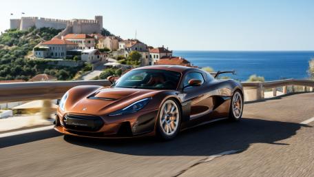 Rimac Hypercar Cruising Croatia Coastal Road with Castle Views wallpaper