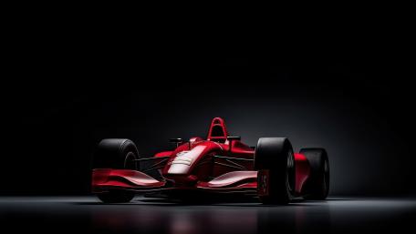 Crimson Formula One Machine Poised Under Studio Lights in 5K wallpaper