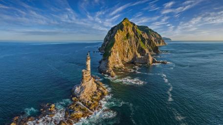 Aniva Lighthouse Sentinel Over the Sea of Okhotsk wallpaper