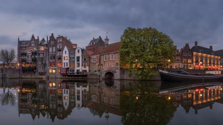 Twilight Reflections Along Rotterdam Canal Waterfront wallpaper