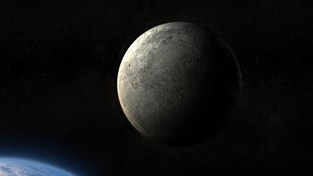 Shadowed Moon Drifting Above Earths Blue Horizon wallpaper