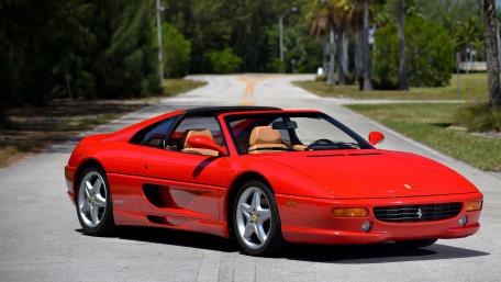 Sunlit Red Ferrari F355 GTS Targa Cruising in 90s Style wallpaper