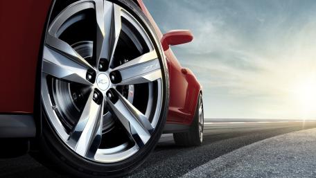 Chevrolet Sports Car Wheel Closeup on Open Road Horizon wallpaper