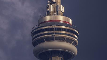 Close Up Majesty of Toronto CN Tower Against Moody Sky wallpaper