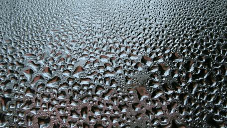 Liquid Silver Droplets in Abstract Metallic Ripple Field wallpaper