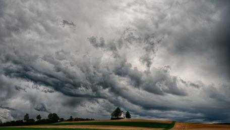 Storm Laden Daytime Sky Above a Lonely Chapel on the Plain wallpaper