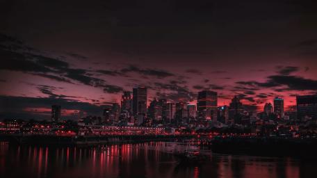 Crimson Dusk Over Montreal Harbor Skyline wallpaper