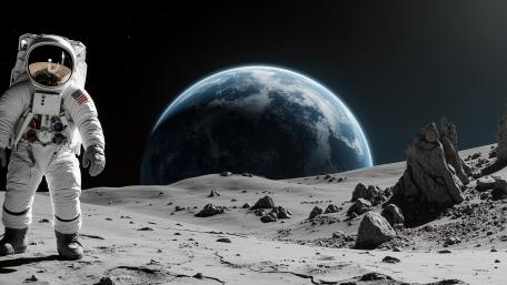 Lone Astronaut Above Silent Moon wallpaper
