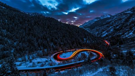 Twilight Serpent Through Snowy Peaks wallpaper