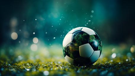 Glowing Soccer Ball on Dreamy Turf wallpaper