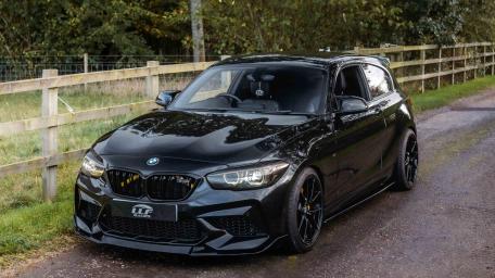 Black BMW M140i on Country Road wallpaper